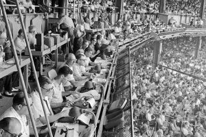 black and white image of a crowded sports stadium