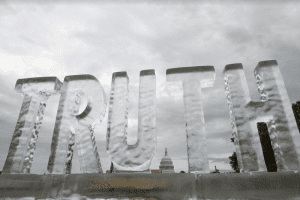 ice sculpture of the word "truth"
