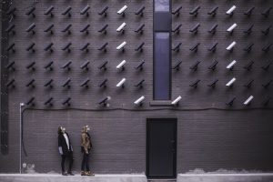security cameras facing two people