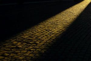 dark sidewalk with a ray of light