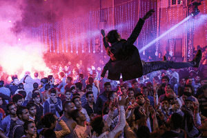 Youth dance at a local wedding in Salam City, a suburb on the outskirts of Cairo.