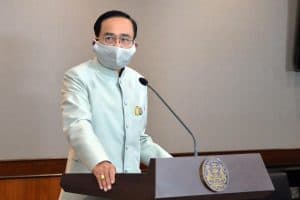 thai prime minister at a podium