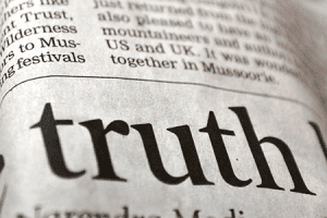 the word "truth" on a newspaper