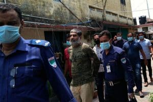 image of Shafiqul Islam Kajol escorted by police