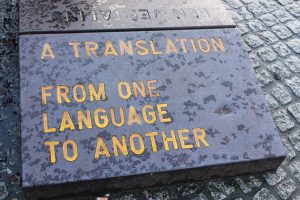 Engraved stone that says “A Translation From One Language to Another”