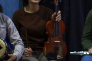 Emel Yeşilırmak seated with violin