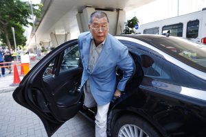 jimmy lai getting out of a car