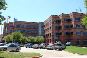 image of buildings surrounding a roadway at collin college in texas