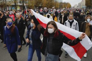 Protesters with old Belarusian national flags march in Minsk, Belarus