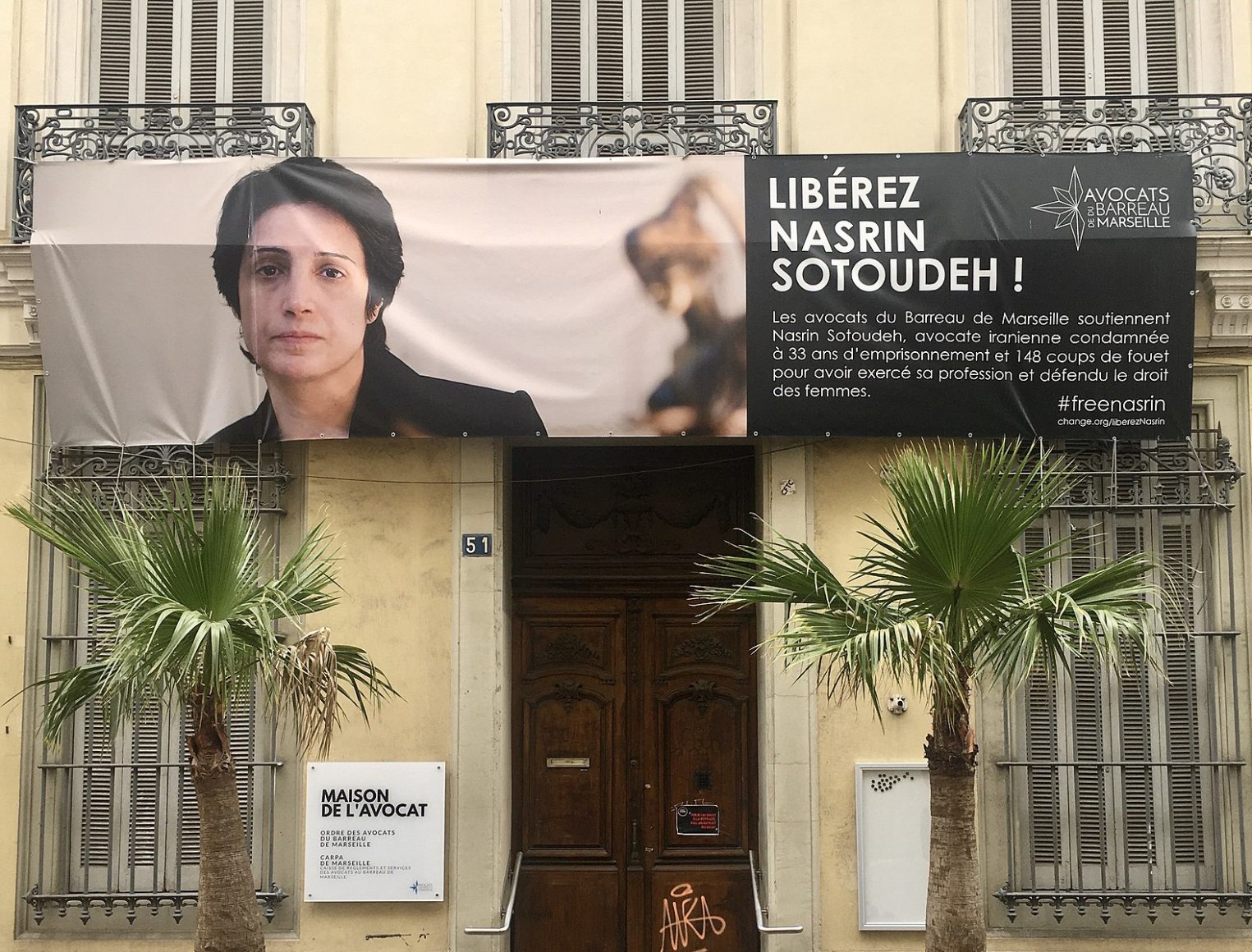 A poster in support of Iranian women's rights activist Nasrin Sotoudeh and demanding her release hangs on a building in Marseille, France