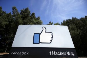 a sign showing the Facebook thumbs up