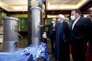 Iran's president and others stand inside nuclear facility