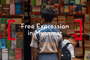 A man looking at shelves of books at a bookstore in Myanmar; on top: “Free Expression in Myanmar”