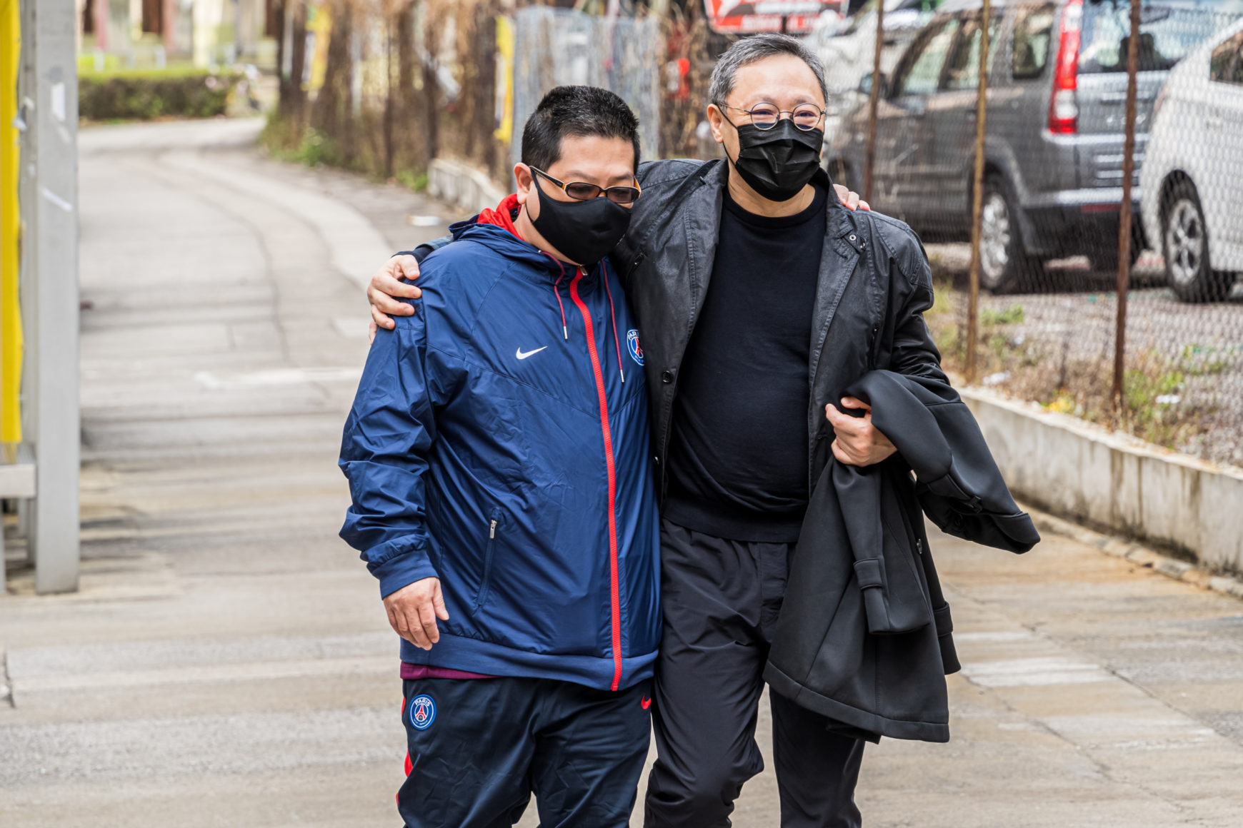 Benny Tai Yiu-ting walks to police station