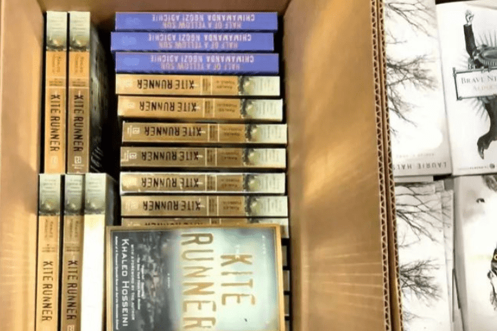 Box of books including the Kite Runner
