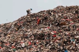 person standing in a landfill