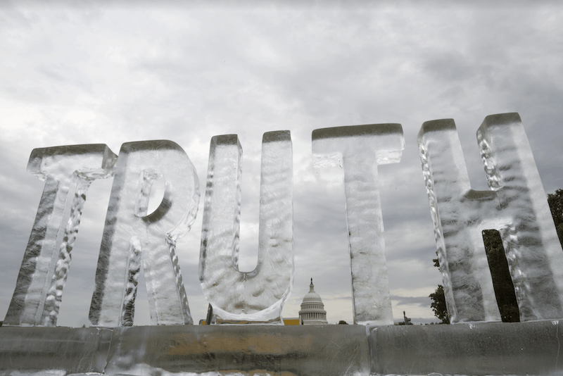 ice sculpture of the word "truth"