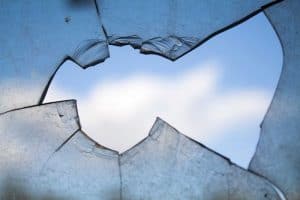 broken glass with a blue sky in the background
