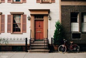 house with a stoop and bike out front