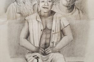 A young man in pants marked with the word “prisoner” sits and smile. Images of an older man and a young man with pensive expressions linger behind him