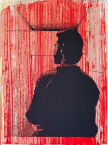 Silhouette of a man facing away from the viewer in a small, empty red room