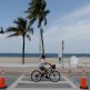 A bicyclist pedaling past Fort Lauderdale Beach