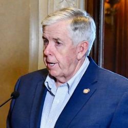 Side shot of Governor Mike Parson speaking