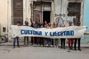 members of the cuban artists group San Isidro Movement stand outside their apartment