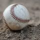 Baseball lying on dirt