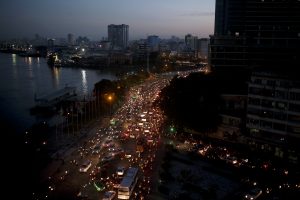 Traffic moves besides the Saigon river during rush hour in Ho Chi Minh City, Vietnam