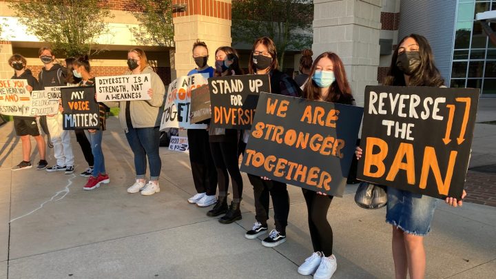 Masked students holding signs outside Central York High School