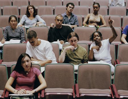 High School Students In Auditorium Participating In Lecture