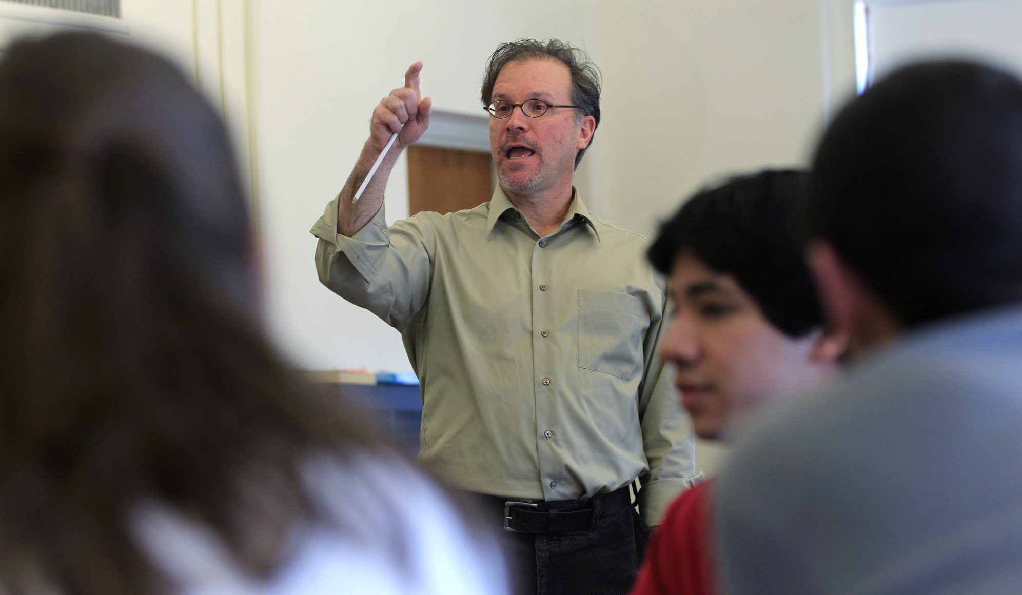 A college professor giving a lecture in a classroom