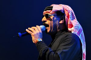 Omar Souleyman profile singing into microphone