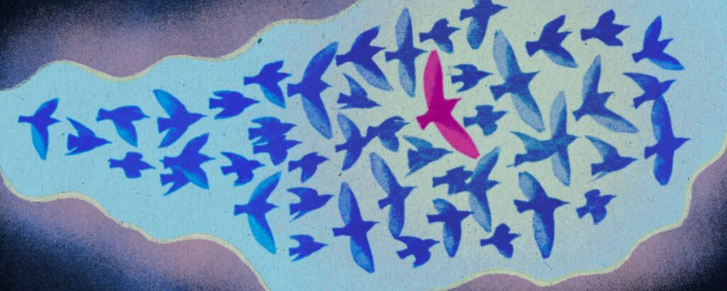 Pink bird flying in the sky surrounded and supported by blue birds