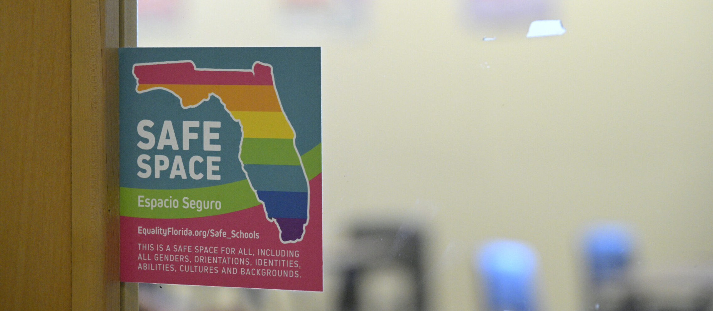 A rainbow, Florida-shaped Safe Space sticker designating a supportive place for LGBTQ+ people is viewed outside of a classroom door at a high school, Tuesday, Aug. 8, 2023, in Orlando, Fla. (Phelan M. Ebenhack via AP)