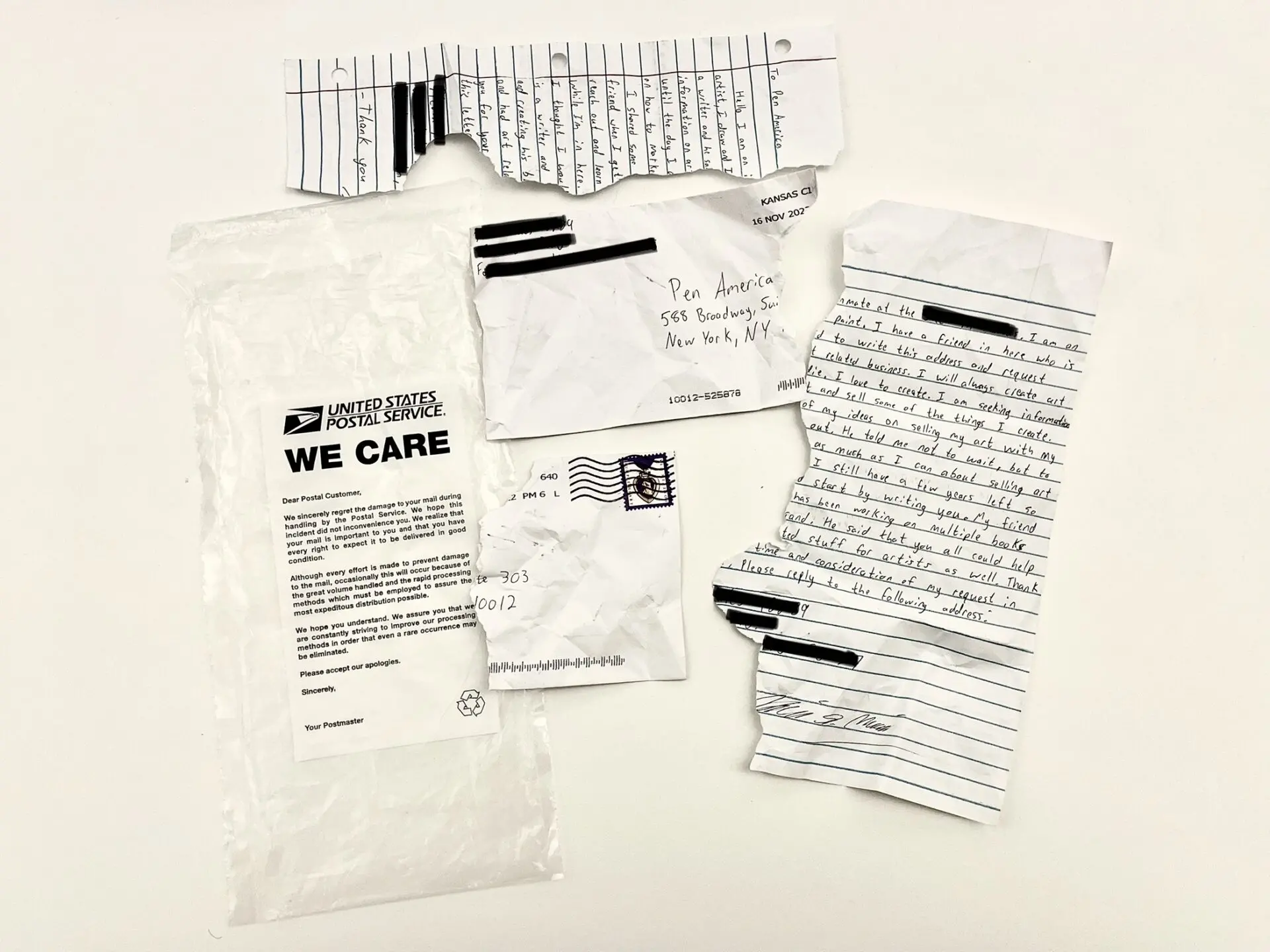 A torn handwritten letter and ripped envelope—likely prison letters mail—are displayed with a white USPS “We Care” bag explaining mail damage. The fragmented but partly legible pieces are scattered on a plain white surface.