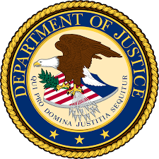 The official seal of the U.S. Department of Justice, featuring a bald eagle clutching an olive branch and arrows, with a shield and a banner reading Qui Pro Domina Justitia Sequitur on a blue and gold circular background.
