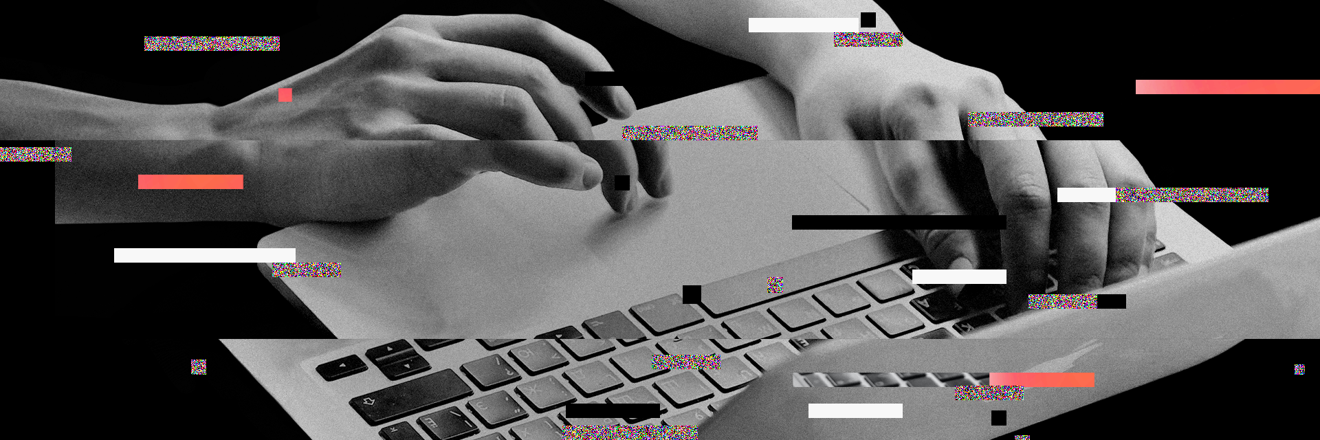 Hands typing on a laptop keyboard with digital glitch effects and colorful static bars overlaying the image.