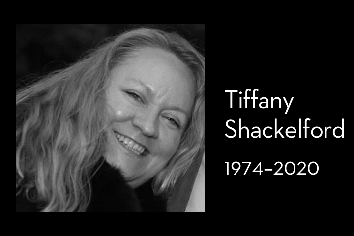 Black and white photo of a smiling woman with long, wavy hair. Next to her, text reads: Tiffany Shackelford 1974–2020.