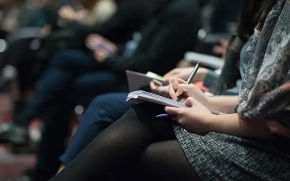 Journalists taking notes