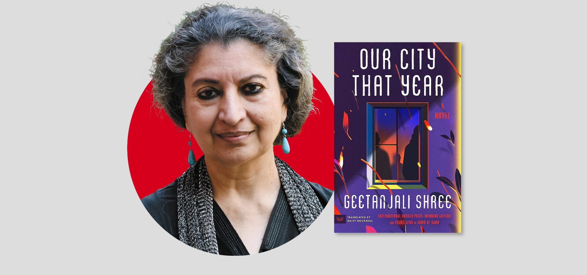 A person with short gray hair and turquoise earrings stands in front of a red circle. Beside them is a book cover titled Our City That Year by Geetanjali Shree, featuring a colorful abstract design.