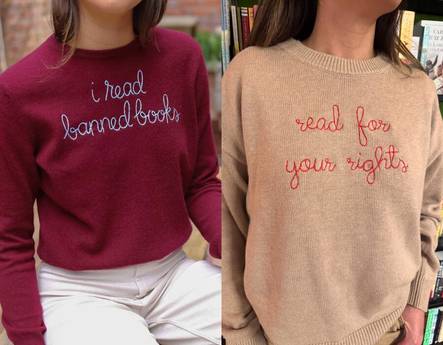 Two people are shown from the shoulders down. One wears a red sweater with the words “i read banned books.” The other wears a beige sweater with “read for your rights” written on it. Both slogans are stitched in cursive.