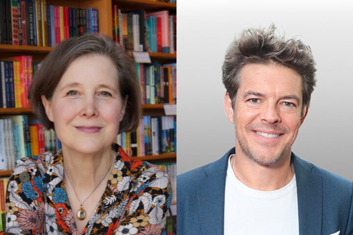 A woman with short gray hair and a floral blouse sits in front of bookshelves; next to her, a man with spiky brown hair and a blue blazer smiles at the camera against a plain background.